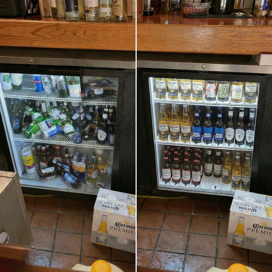 A perfectly organized glass-front commercial cooler with drinks sorted by type and color, showcasing an efficient FIFO system.