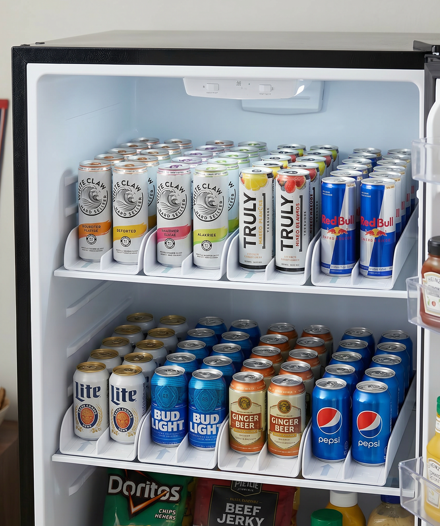 Fridge drink organizer with FIFO system holding soda cans, seltzers, and energy drinks neatly aligned in an organized home refrigerator