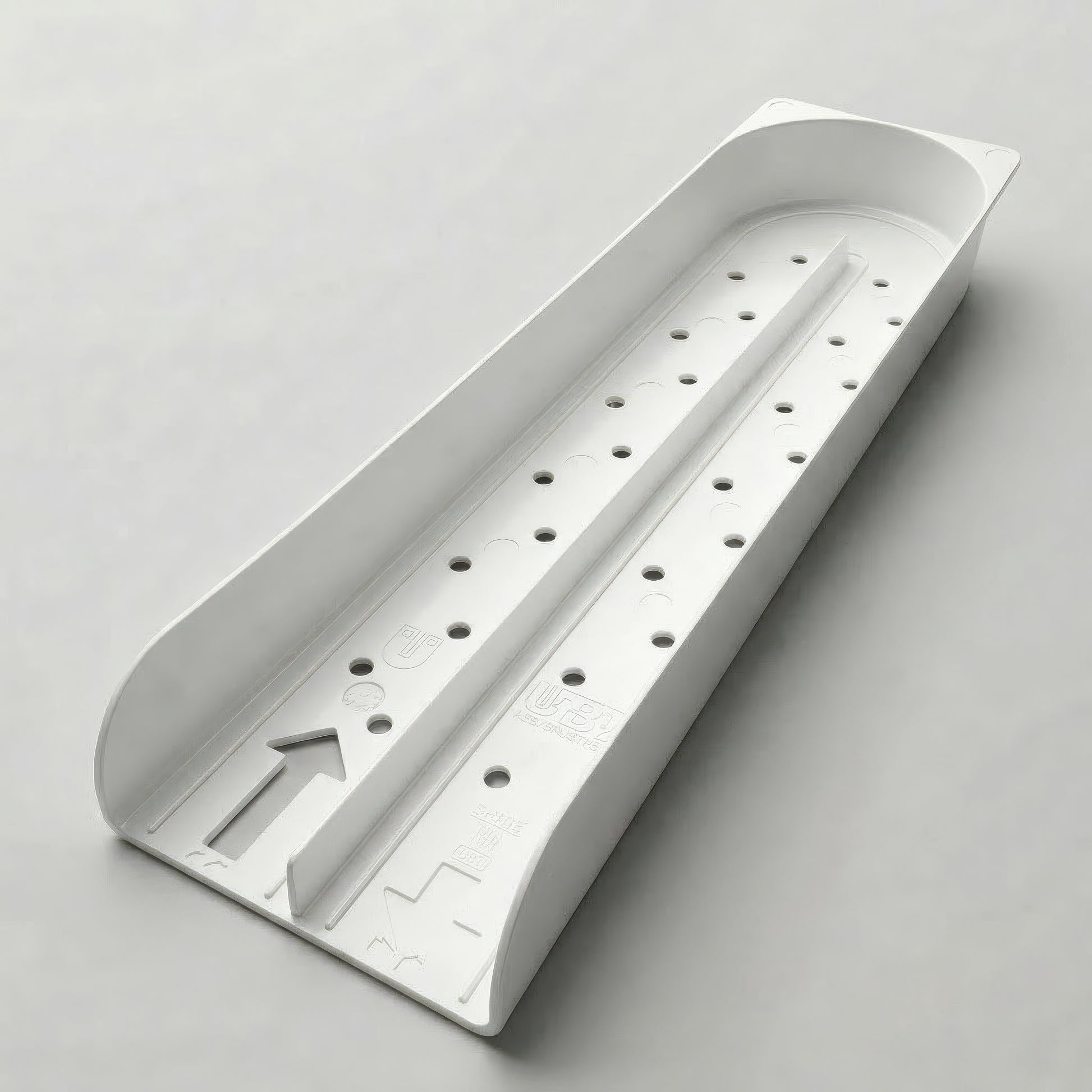 White plastic tray with multiple holes on a light gray background